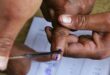 Voting process with inked fingers