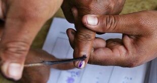 Voting process with inked fingers